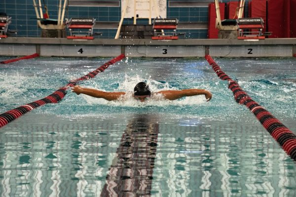 Sofia Long, a senior butterfly/freestyle swimmer on the black squad, competes in the 100-yard butterfly. Long was named one of three captains for the 2023-24 season by head coach Roy Coates.