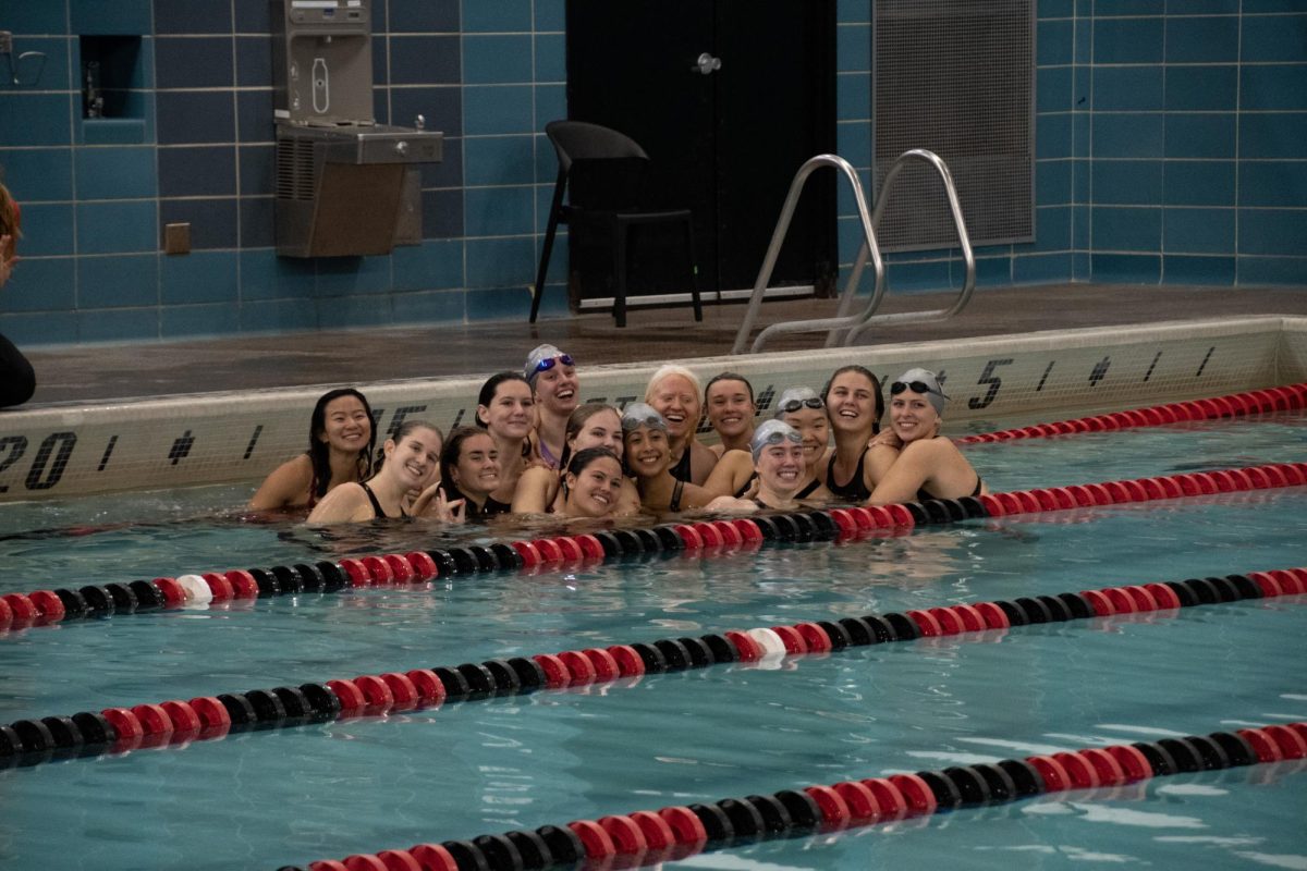 The red squad smiles for a picture in the pool. They defeated the black squad.
