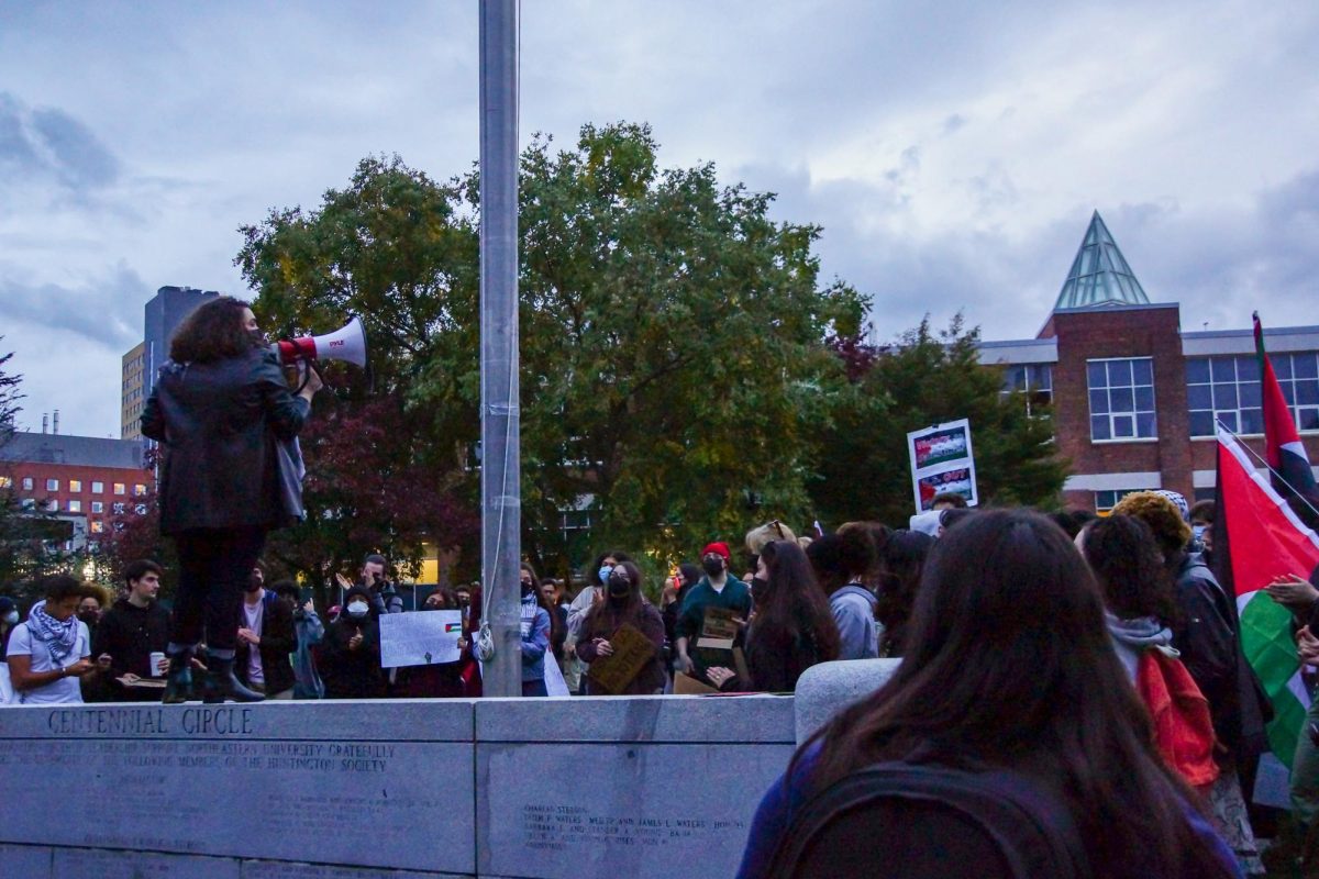 An anonymous protestor speaks to the crowd at the rally. The rally was the second gathering organized by Huskies for a Free Palestine in the past week.