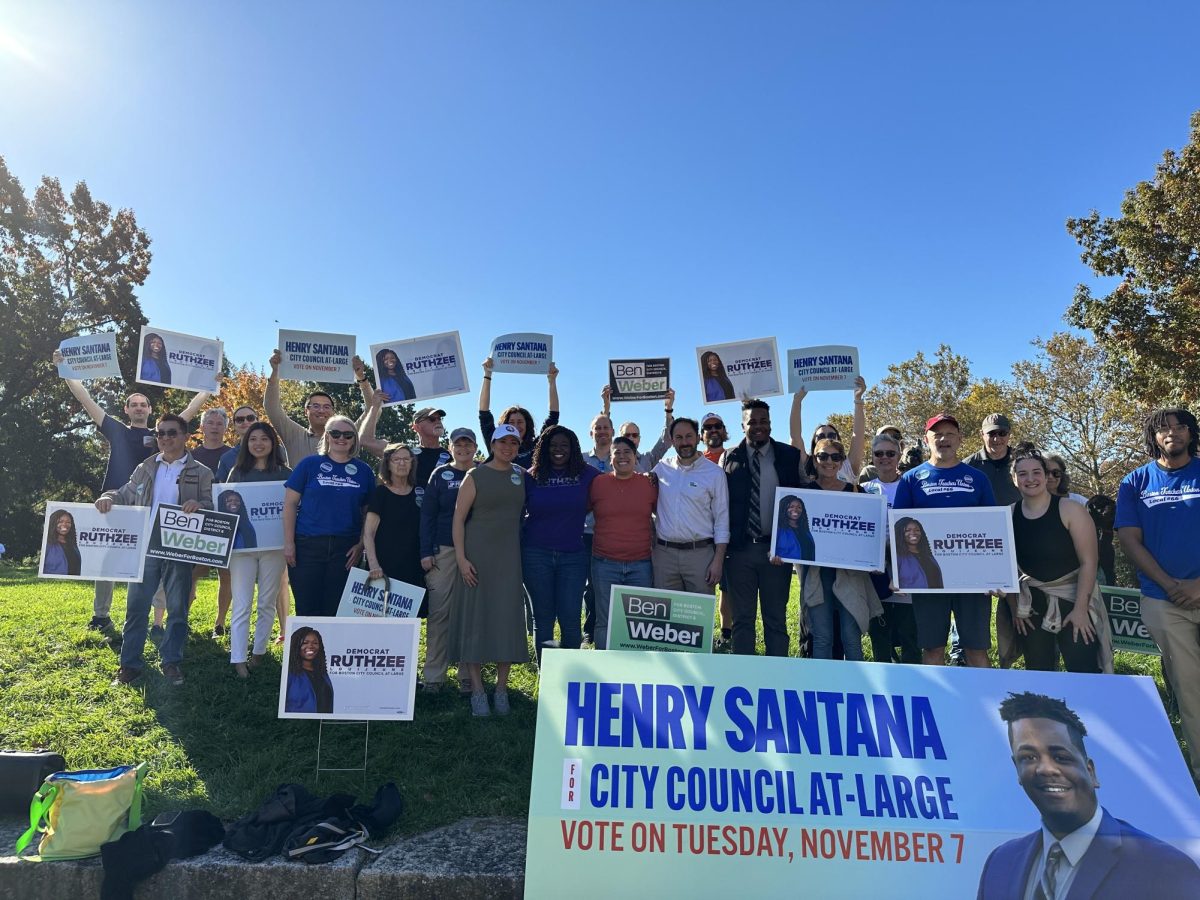 Supporters of Henry Santana, Ruthzee Louijeune and Ben Weber pose for a photo. Santana, Louijeune and Weber gathered in Jamaica Plain Saturday to speak with their supporters and show support for each others campaigns.