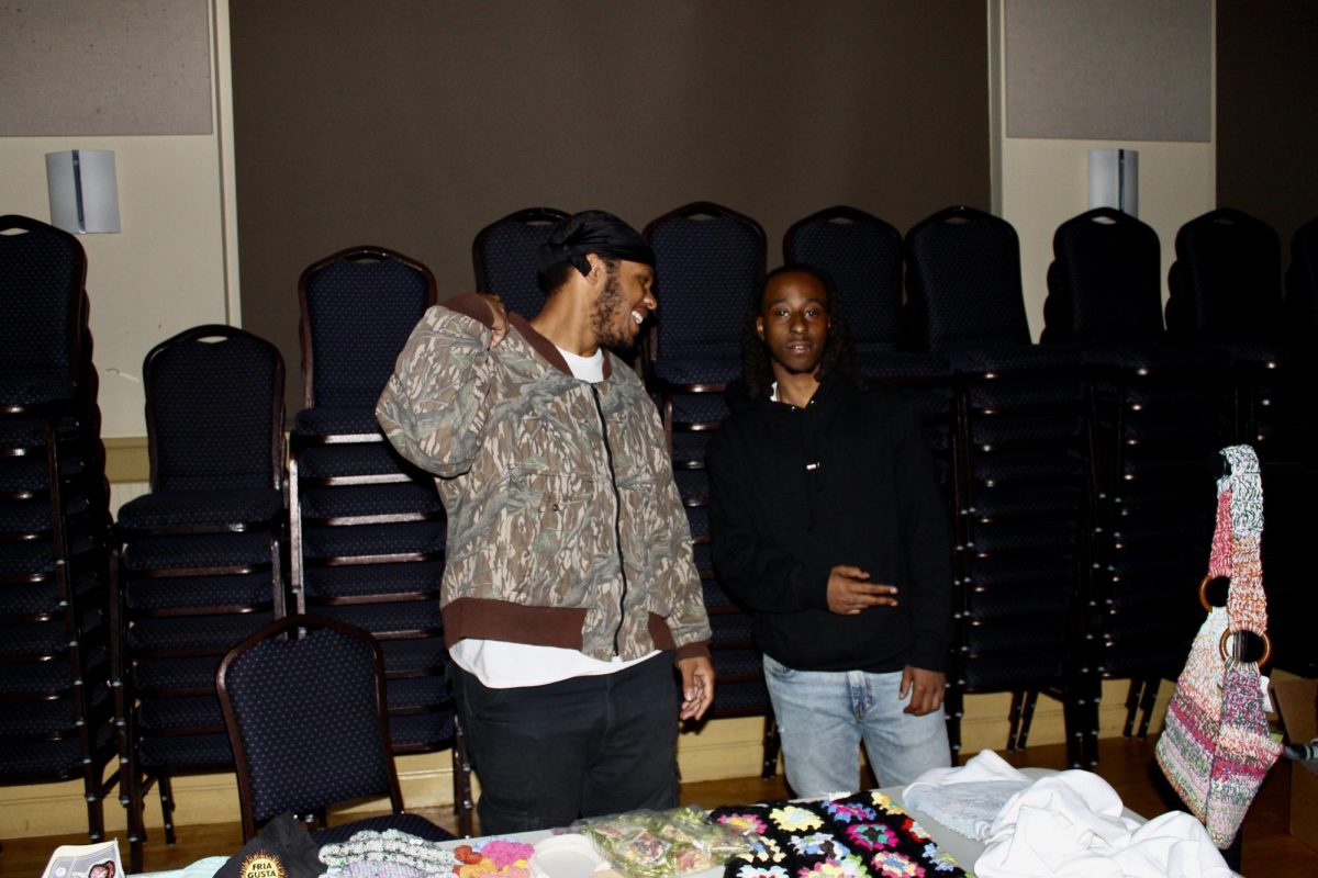 Sean Hargrove and Darrien Johnson sell handmade clothing by Dorsey Atelier and Something Sweet, two local fashion enterprises. Vendors also fresh pressed Thrill t-shirts throughout the event.