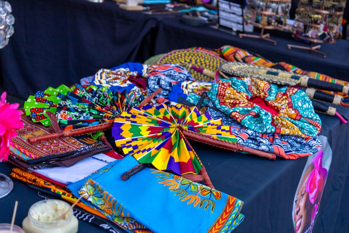 A colorful collection of bonnets and scarves blanket vendor Natasha Williams’ table. Williams started out selling body butters four years ago, and has since expanded her skincare line into a lifestyle brand called Natashas Closet,which she promotes once a month at SoWa Open Market.