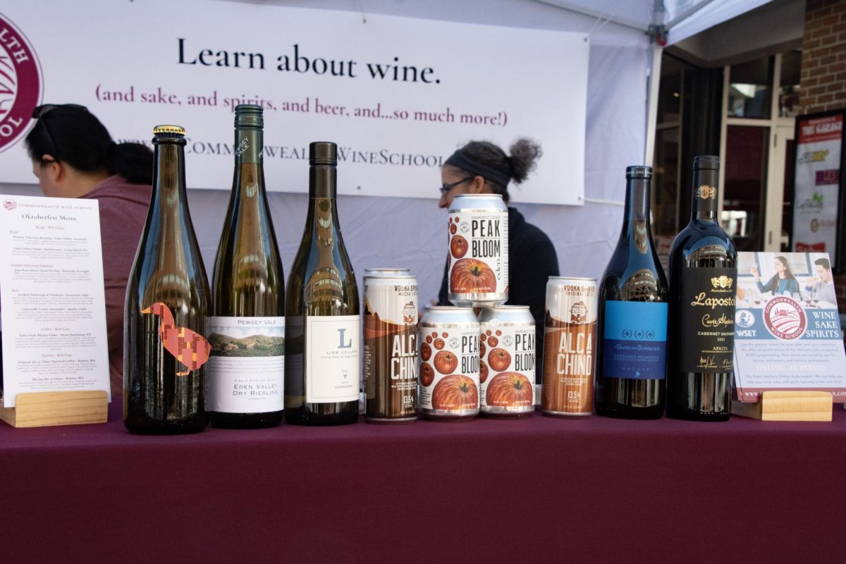 Various bottles of alcohol line the table of the Commonwealth Wine School’sbooth. The booth’s vendors offered attendees insight into the school’s available classes and certifications. 