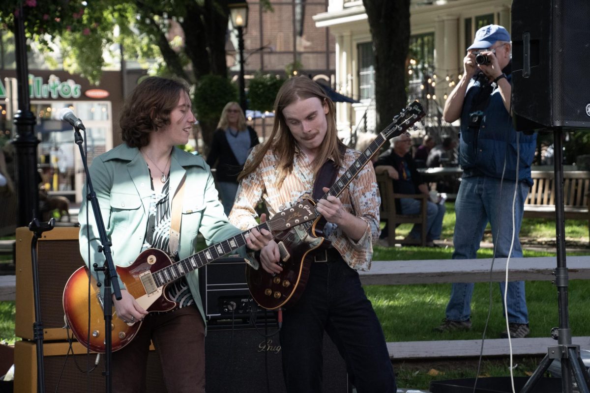 Cameron Levesque (left) and Christian Eagleston (right) of Rumboat Chili play their guitars. The band played classic rock tunes, much to the delight of the audience. 