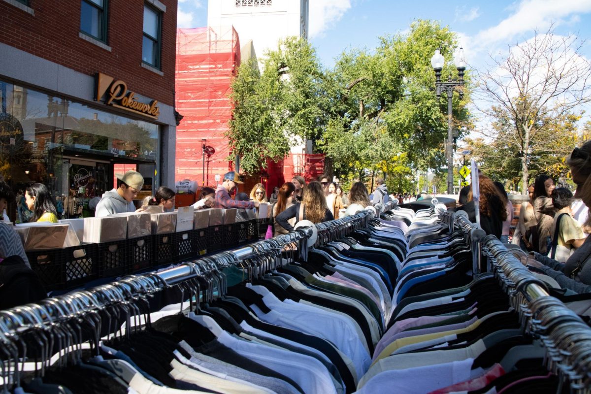 People scour through the poster and T-shirt offerings from The Vintage Underground. Several booths and racks were at Oktoberfest, offering a selection of clothing and accessories. 