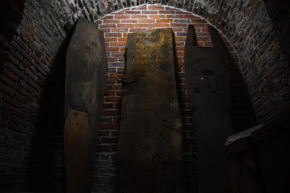 A light within the crypt’s open tomb illuminates the historic coffins found inside, with a coffin most likely for a child propped up against an assumed adult coffin in the bottom left corner. The open tomb was available for pictures and viewing.