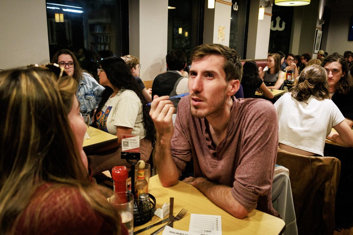 A participant at Trident’s trivia night contemplates a question before submitting his final answers at the end of the round. The round concluded with a series of photos of cartoon bats which participants had to identify.