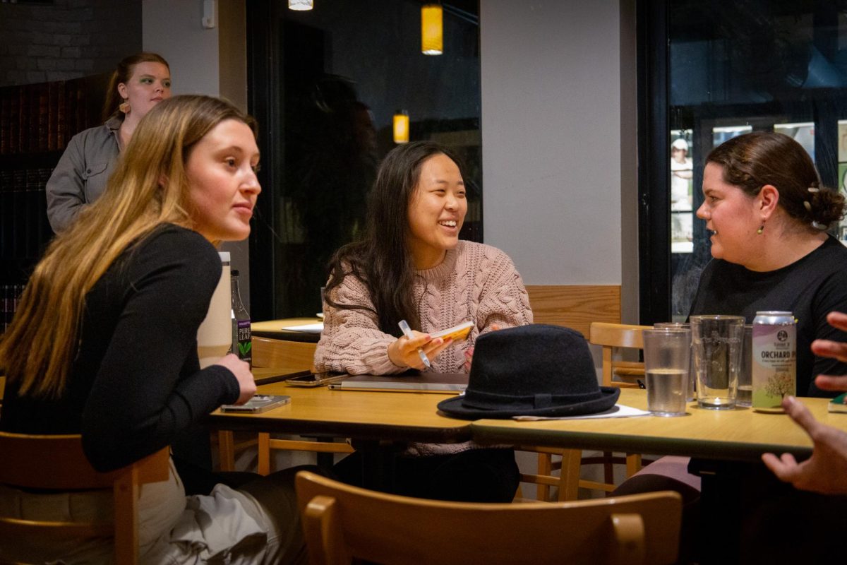 Two participants at Trident’s open mic night discuss each others work following a reading. As regular attendees, they became familiar with each other’s bodies of work and presentations.