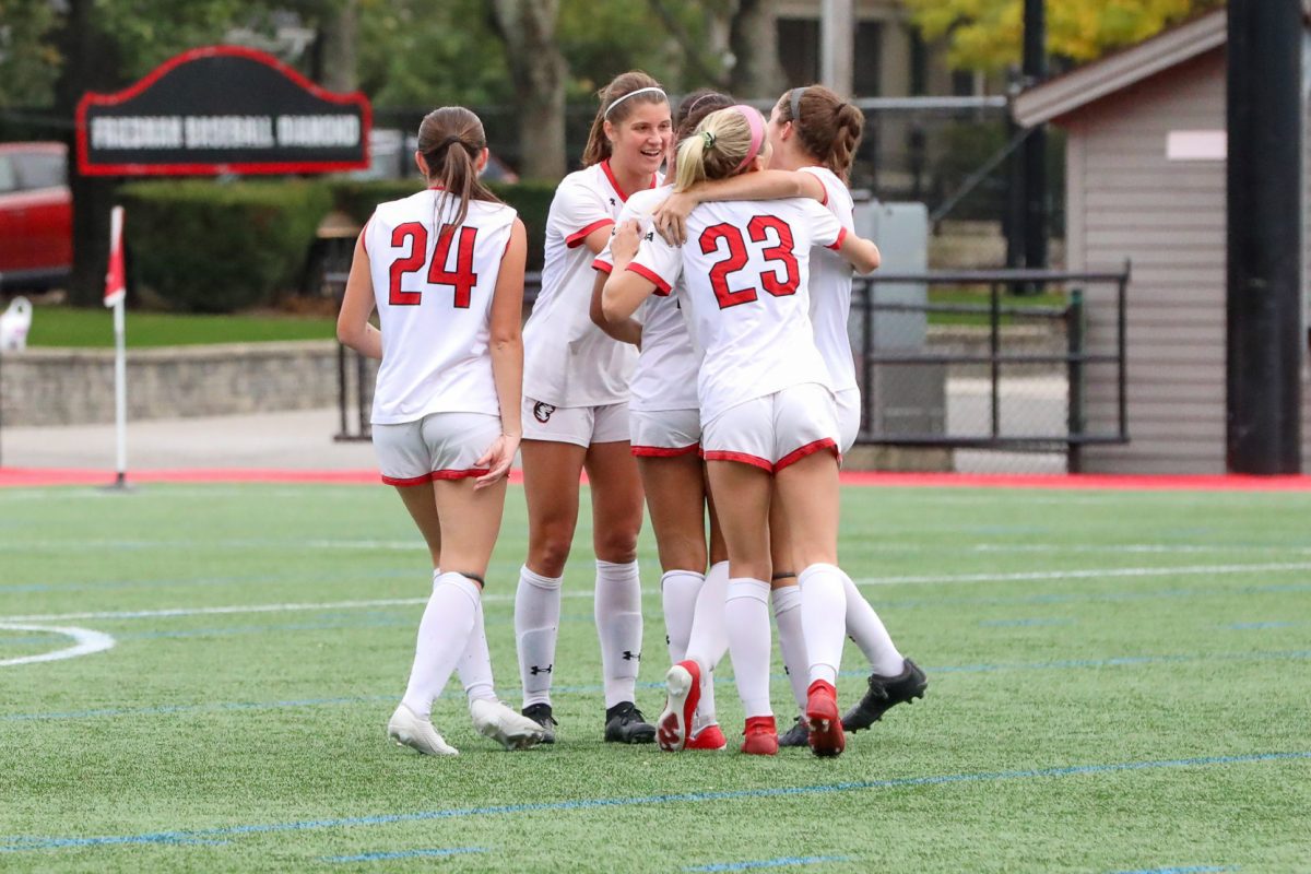 The Huskies celebrate a 1-0 win over Towson University Oct. 15. The victory secured the 13th-consecutive CAA tournament bid for Northeastern. Photo courtesy Delaney OBrien.
