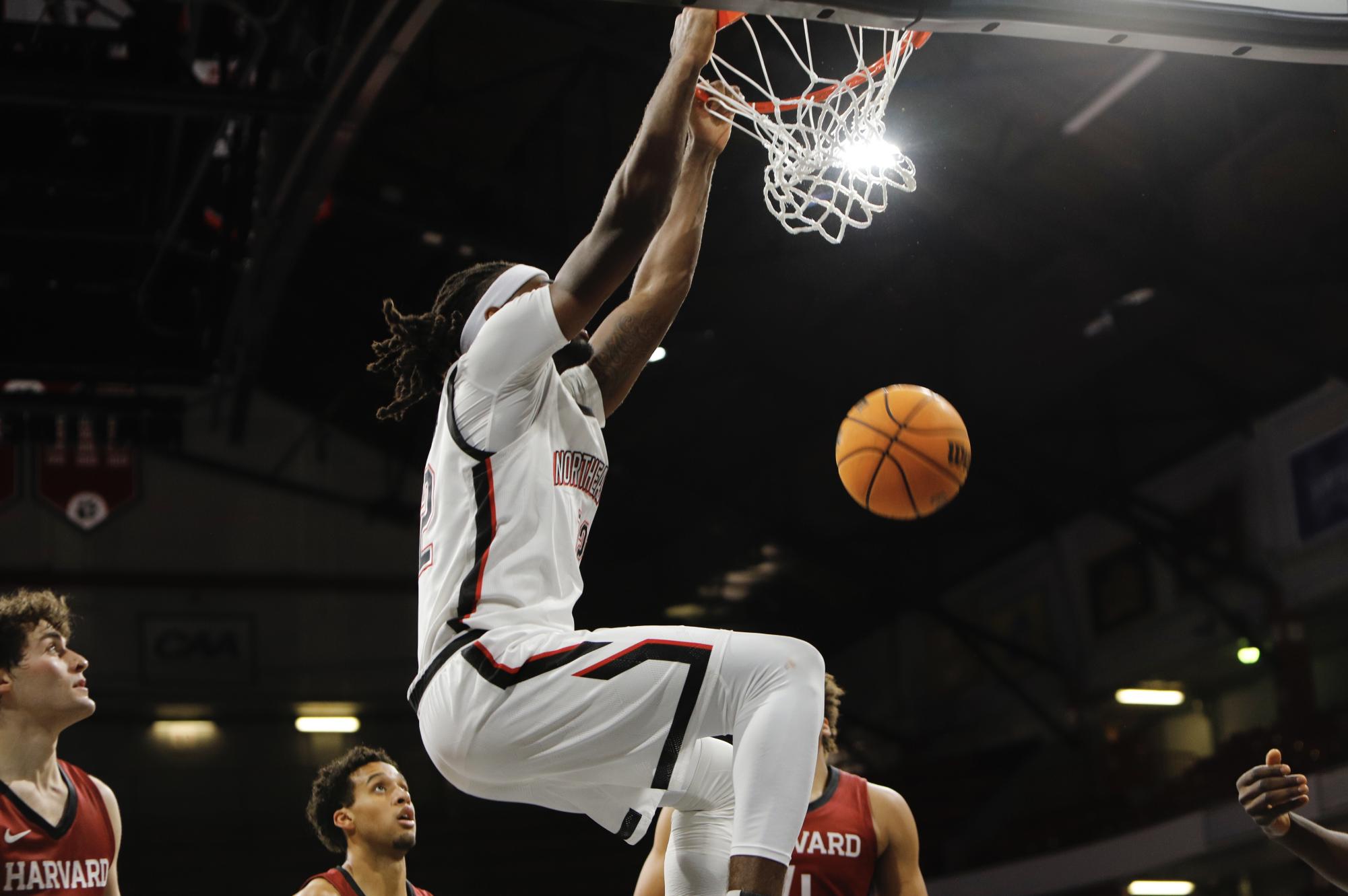 Senior forward Alexander Nwagha slams the ball into the net. Last season, Nwagha led the Huskies in blocks (22) and was tied for second in steals (20).
