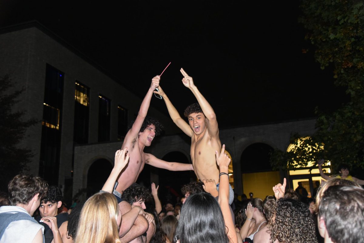 Two students cheer atop two other students shoulders. The 17th annual underwear run occurred Oct. 21.
