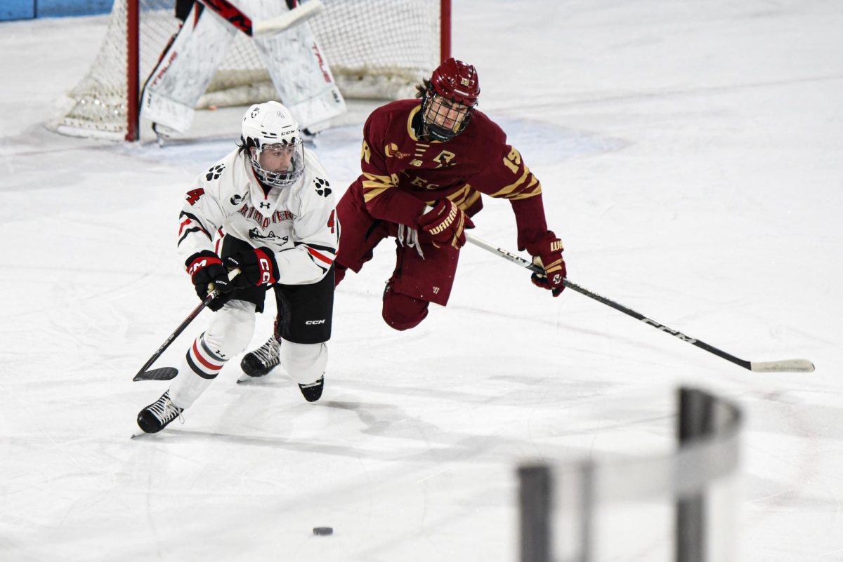 Pito Walton races against BCs Cutter Gauthier in Matthews Arena. Northeastern fell in the home ice game 3-1. 