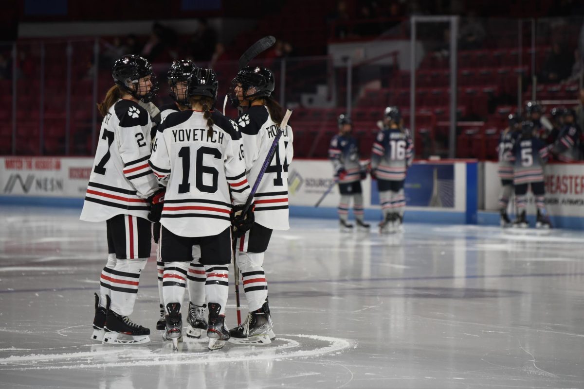 Northeasterns on-ice unit talks between plays in a game against UConn. UConn shut out its fellow Huskies two nights in a row in early November. 