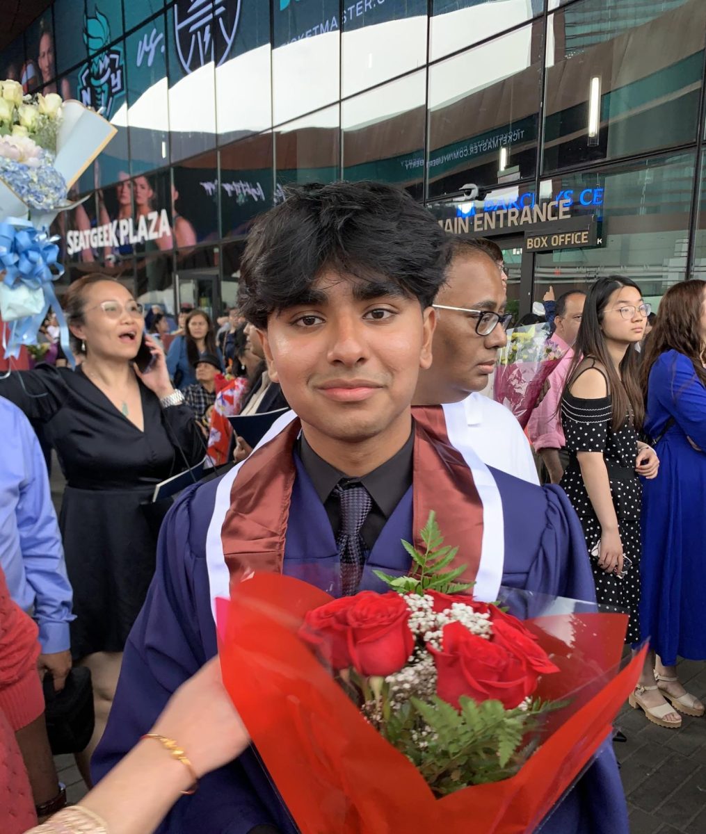 Arif+Mohammed+poses+for+a+photo+in+a+graduation+gown.+Mohammed%2C+a+freshman+at+the+Oakland+campus%2C+was+killed+in+a+double+hit-and-run+in+November.+Photo+courtesy+GoFundMe.