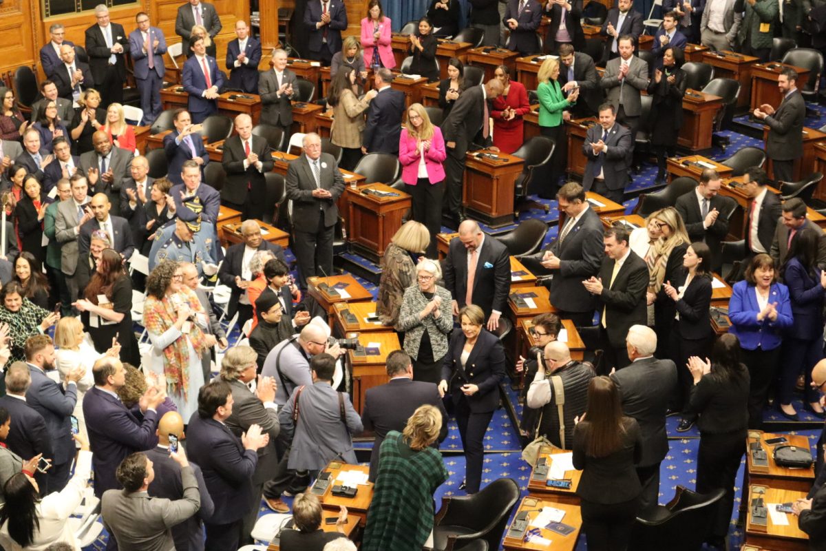 Healey greets attendees on the House floor. Healey shared stories about Boston residents who would be helped by accomplishments like the MassReconnect program and the proposed Affordable Homes Act. 