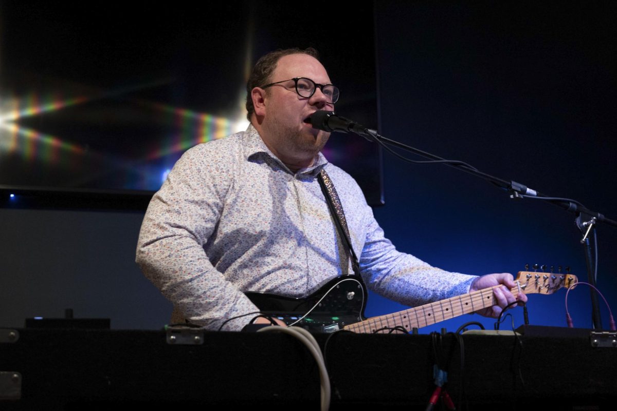 James Burke plays the electric guitar while singing during a music event dedicated to Martin Luther King Jr. at The Square Root in Roslindale Jan. 14. Read morehere.