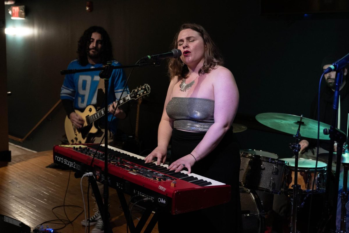 Nilles sings and plays the keyboard while Sergio Romero, the lead guitarist of Ruby Grove, accompanies her on guitar. Sunday’s performance at The Square Root was Romero’s first show with the band.