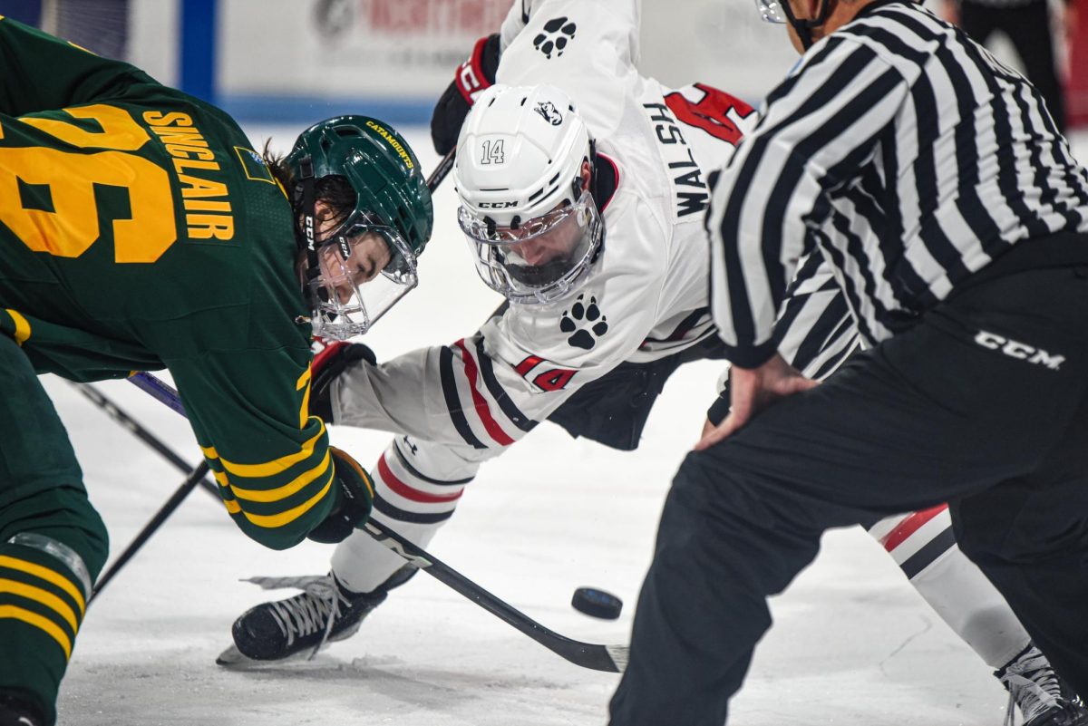Graduate student forward Liam Walsh prepares for a faceoff. The Huskies maintained strong possession of the puck in their second match against Vermont on Saturday.