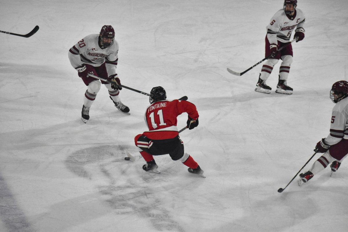 Fontaine handles the puck in a game against UMass Amherst. The Huskies fell to the Minutemen 2-1.