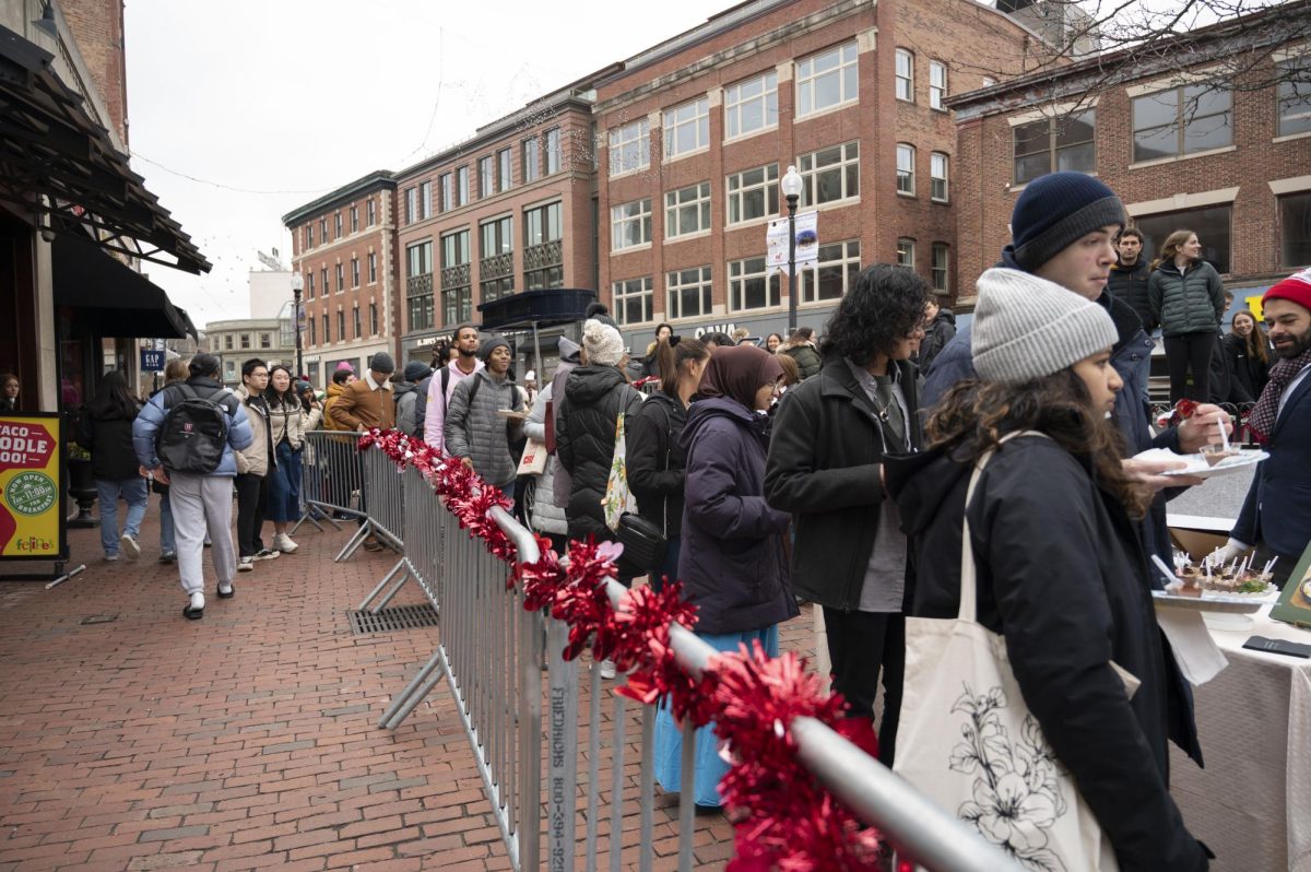 Visitors wait in line for free chocolate samples. Hundreds showed up to the festival and waited their turn for the sweets.