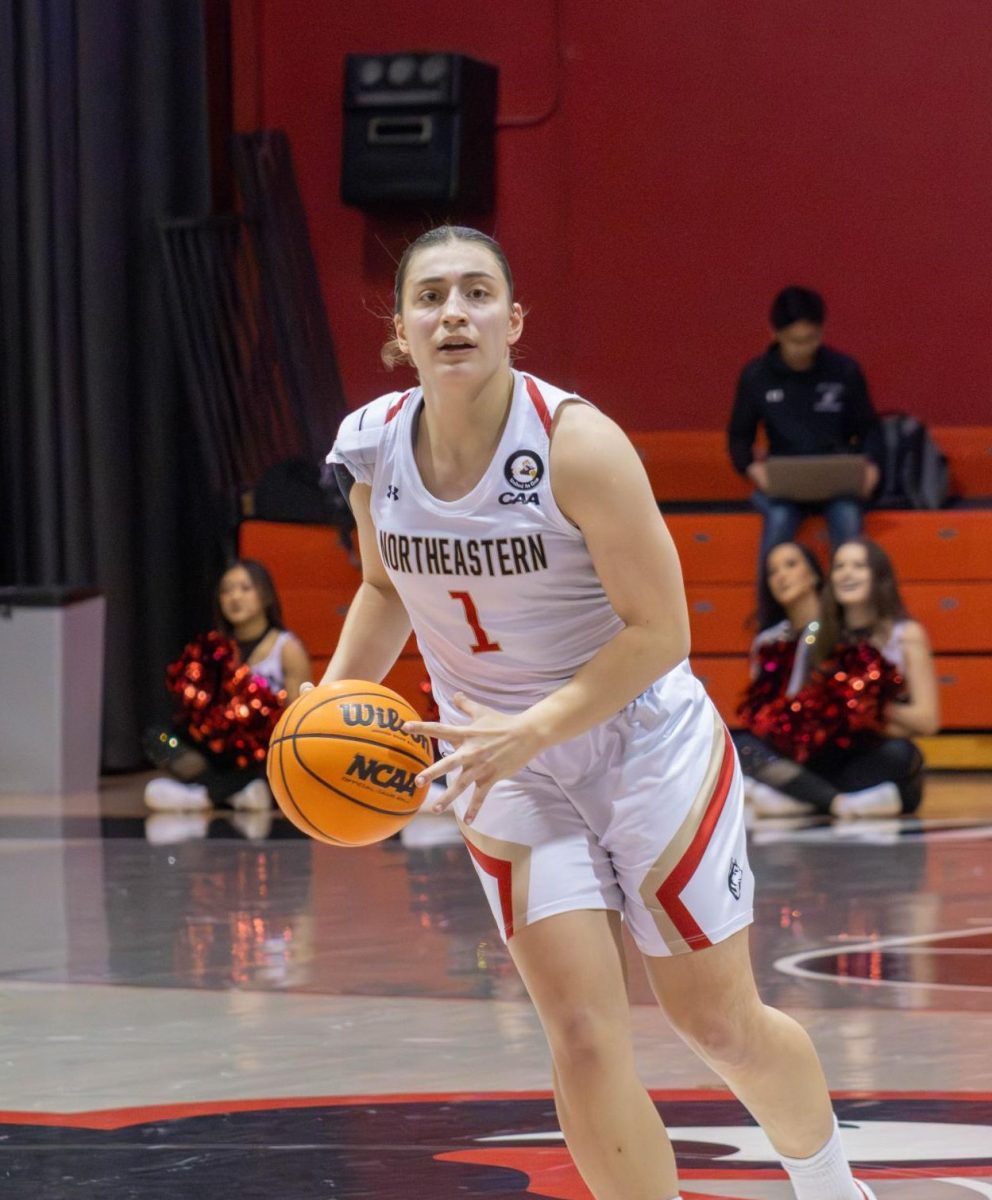 Derin Erdogan holds possession of the ball in a game against BU. Erdogan was responsible for over a quarter of Northeasterns points that afternoon, tallying 21. 
