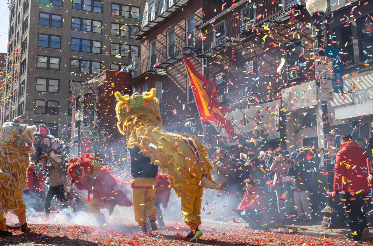 Volunteers pop confetti cannons over lion dancers at the annual Lunar New Year parade in Chinatown Feb. 18. Read more here.