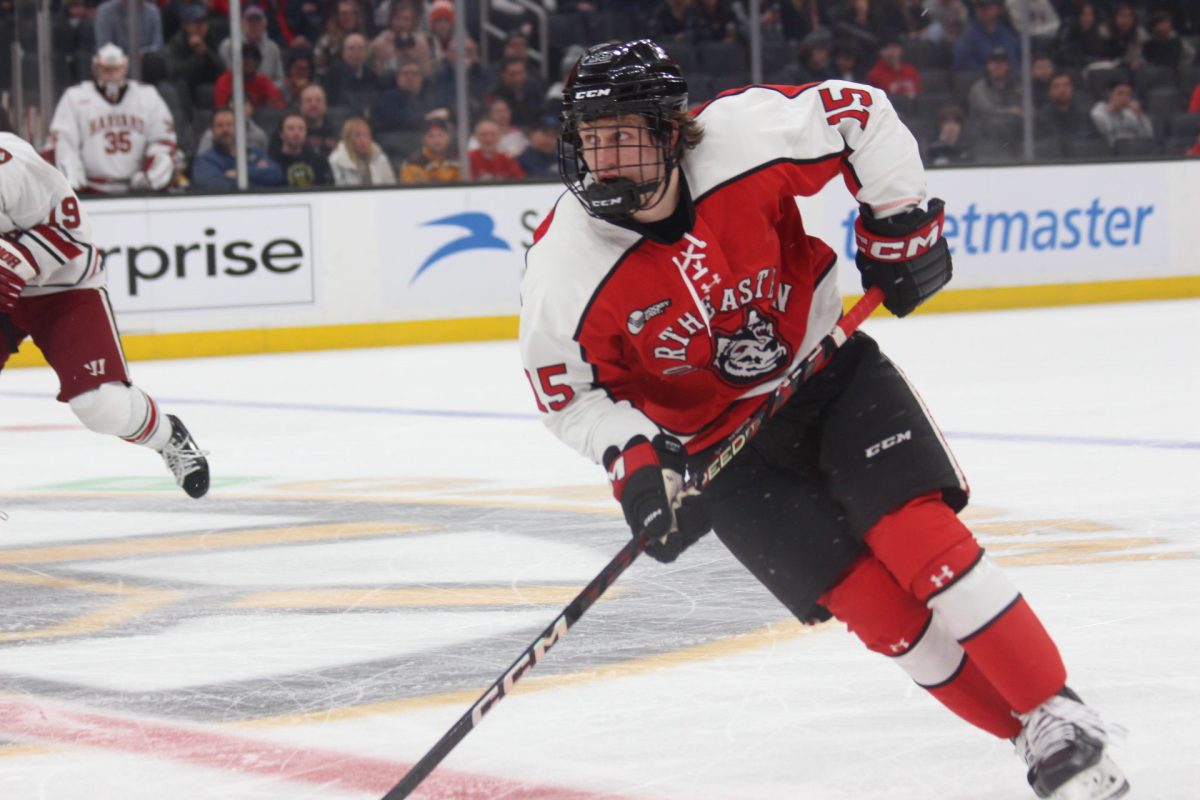 Jack Williams skates down the ice in the 2023 Beanpot finals. Williams is the Huskies points leader this season with 30 points (14 goals, 16 assists).
