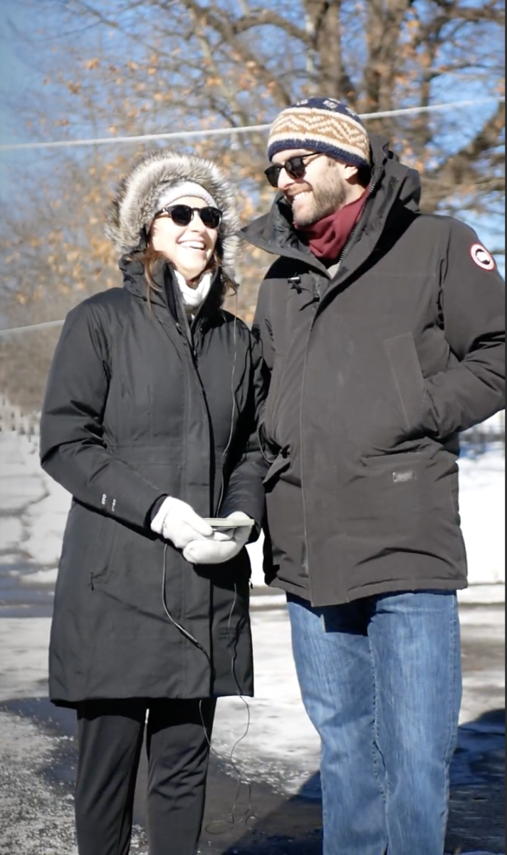 Fiances Heidi Peterson and Tom Troxel bundle up next to each other while walking through a snowy Boston Common. The couple enjoys hiking locally, and Troxel proposed to Peterson at Middlesex Fells in April 2023.
