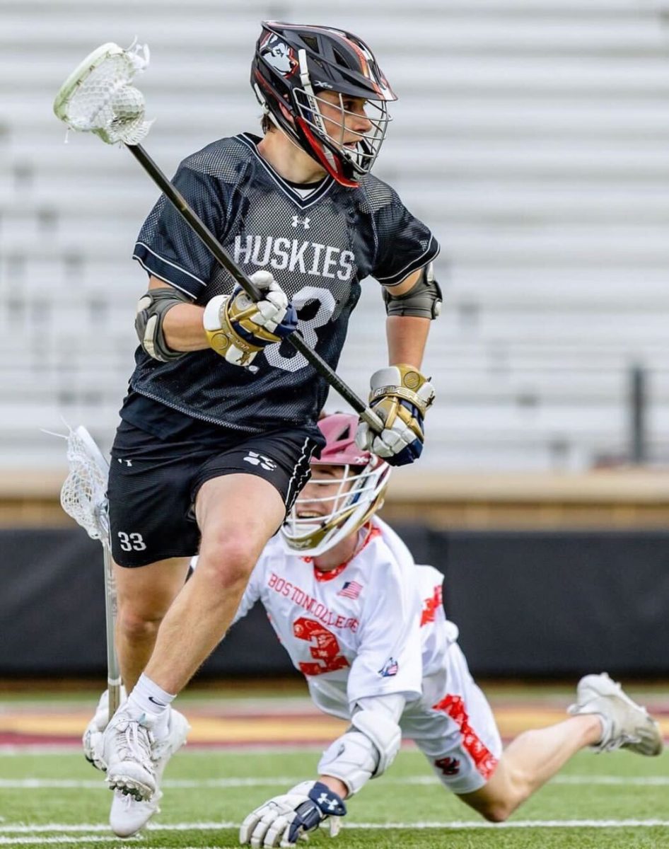 Christopher+Lenahan+Jr.+carries+the+ball+down+the+field+for+Northeastern.+Northeastern+defeated+South+Carolina+in+overtime+April+6.+Photo+courtesy+Christian+Gomez.