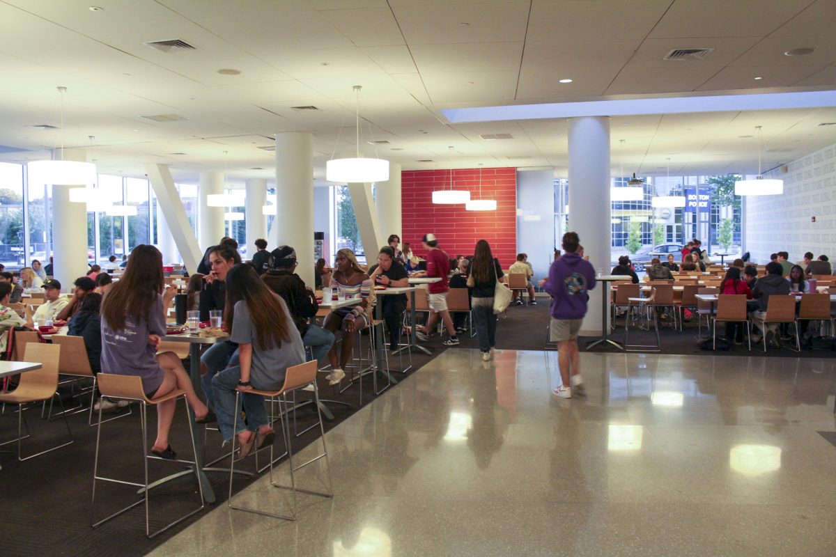 Students socialize and eat in the International Village dining hall. Many students with allergies and dietary restrictions have had trouble finding suitable meals at Northeasterns dining halls.