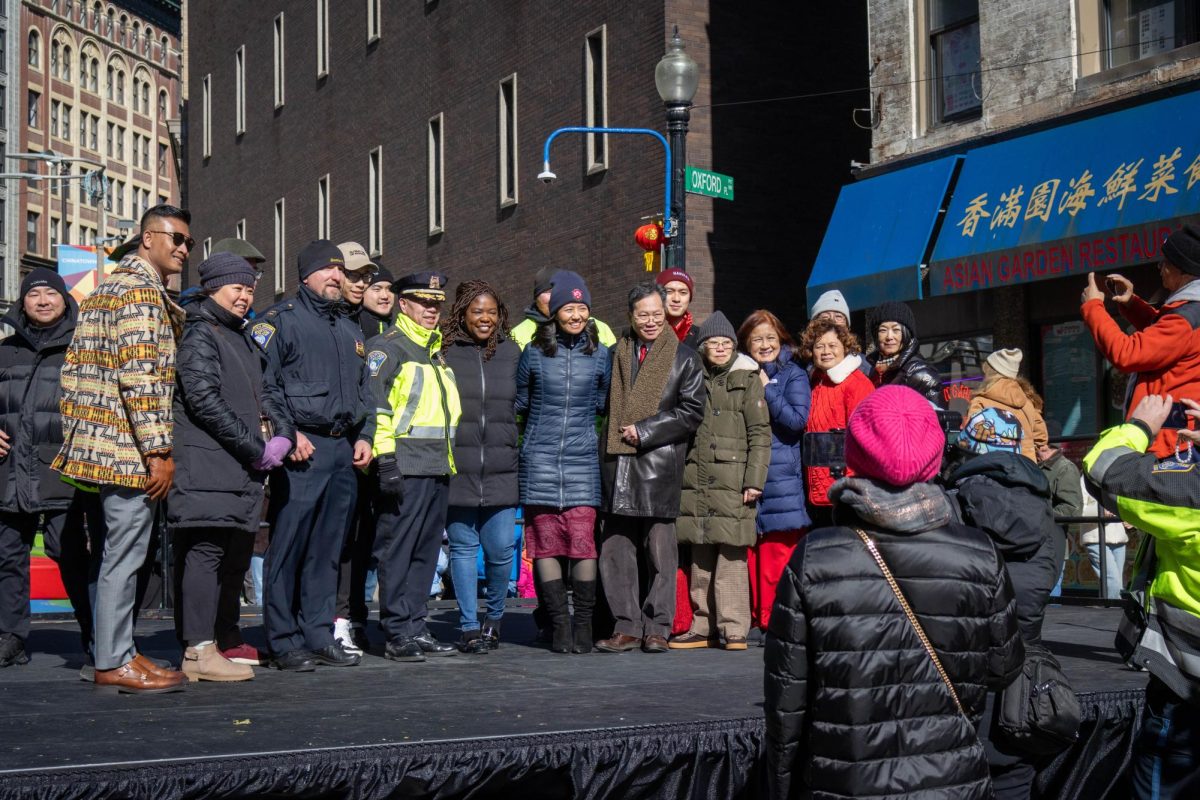 Wu poses with friends and organizers of Boston’s Chinatown Main Street for a photo. Located in the middle of Harrison Avenue, multiple dance groups performed on the temporary stage.