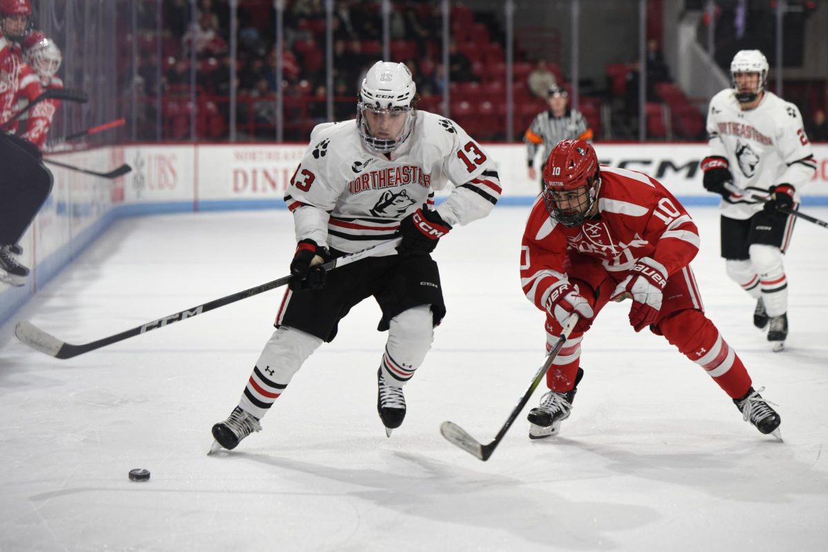 Dylan Hryckowian races toward the puck. Hryckowian scored the game-winning goal in overtime against BU Tuesday night.
