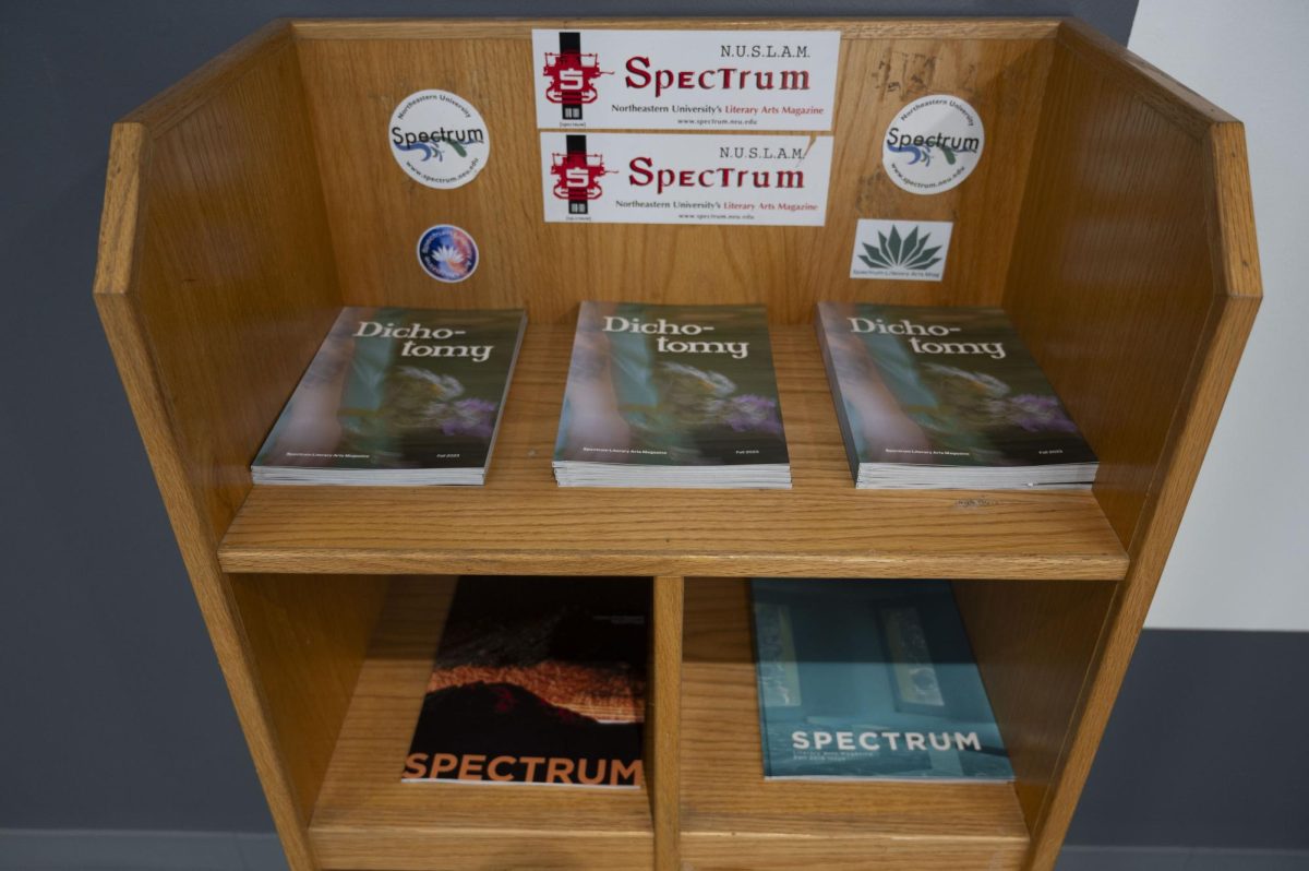 Stacks of past Spectrum issues sit in a magazine stand outside of the clubs office in Curry Student Center. The magazine has made a goal of being an inclusive, creative environment for all students, regardless of what one might study.