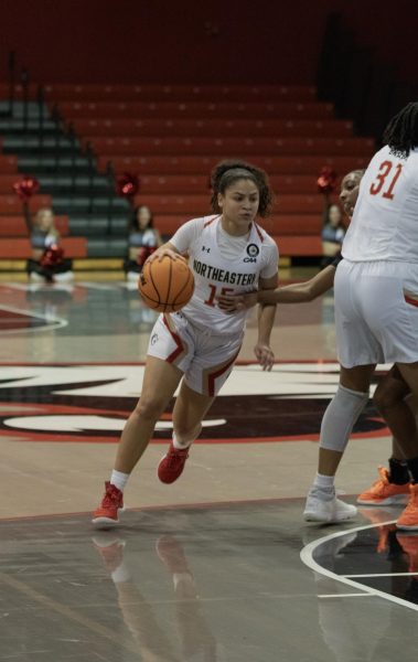 Freshman guard Yirsy Queliz dribbles the ball down the court for the Huskies. Northeastern fell to Stony Brook 71-35 Jan. 11.