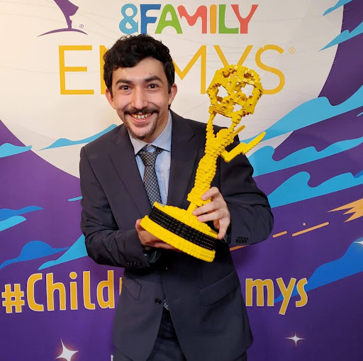 Mitchell Rusitzky poses for a photo while holding his Emmy at the Children’s & Family Creative Arts Emmys Dec. 16.  The 2023 alum, along with his team at Baobab Studios, earned an Emmy in the Outstanding Interactive Media category for the game “Galactic Catch.” Photo courtesy of Alex Tinsman.
