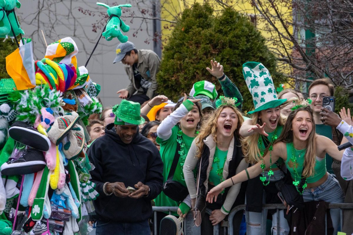 Spectators cheer while dressed in green clothing and shamrock bead necklaces during the annual South Boston St. Patricks Day Parade March 17. Read more here.