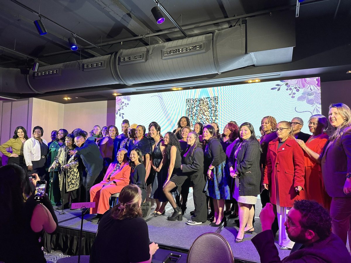 Honorees and other attendees of the EXTRAordinary Women’s Reception pose for a photo. MOWA hosted the event, during which 41 honorees were recognized in the categories of economic equity, health, safety and representation.