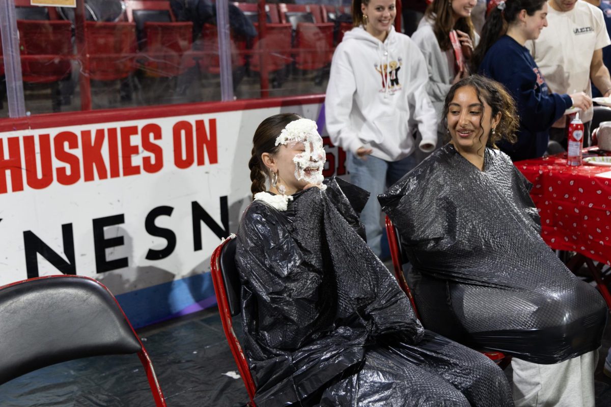 A student smiles after getting pied in the face during Northeasterns Relay for Life fundraiser March 22. Read more here.