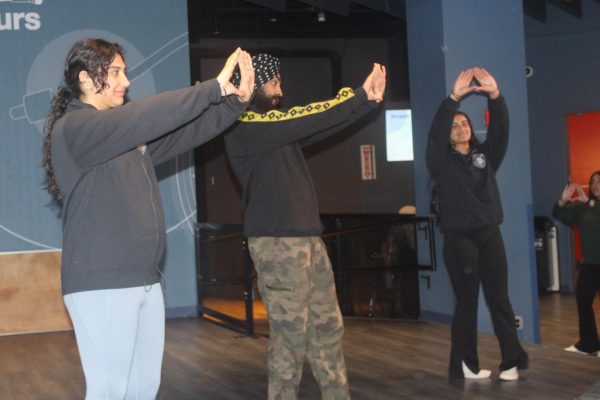 Student leaders demonstrate fundamental movements of Bhangra. By going through individual dance moves and slowly stringing them together, NSSA made the workshop accessible to all dance levels.