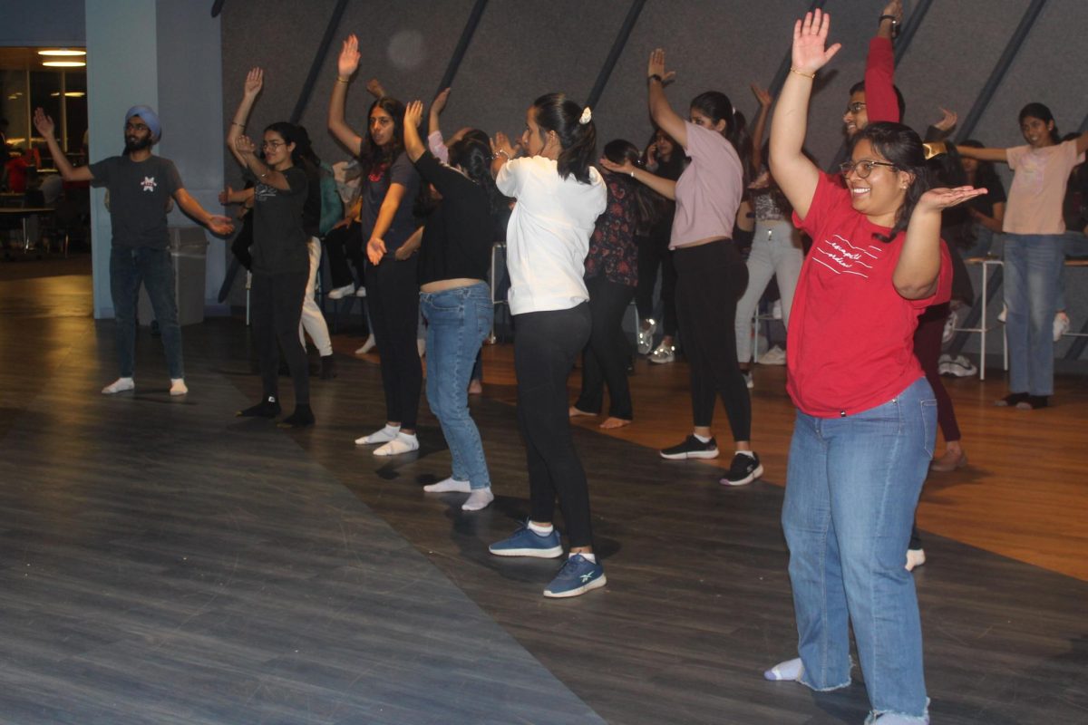 Dancers clap along to the music and smile as they continue to learn new moves. With the hands-on instruction, even the most inexperienced dancers picked up Bhangra quickly.
