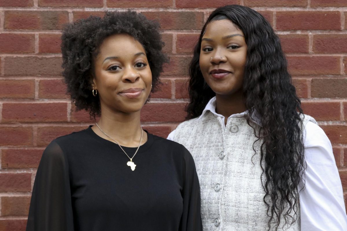 Ashleigh Chiwaya (left) and Naomi Barrant pose for a photo. The two Northeastern students and friends co-founded Nuly Root’d, which aims to roll out Black haircare product vending machines in the fall.