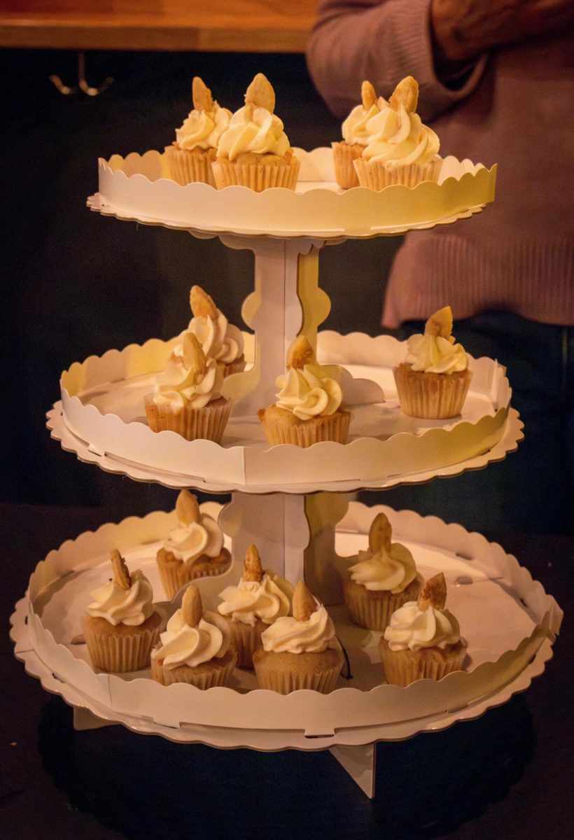 Loomis’ apple pie-inspired cupcakes sit on a three-tier display. The competition included key lime pies, vegan whoopie pies, apple pies, black lemon tarts, cardamom cream cake, pandan cream pie and cashew caramel crunch pie.