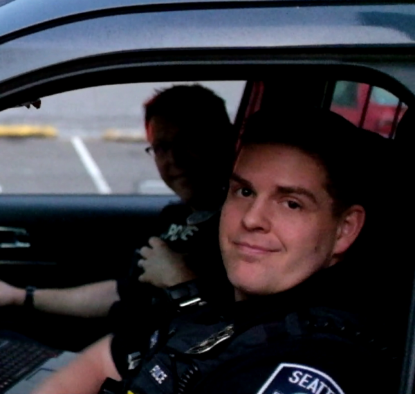 SPD officer Kevin Dave in a police cruiser. Dave struck former Northeastern student Jaahnavi Kandula with his cruiser in January 2023. Photo courtesy Lucy Parsons Labs.