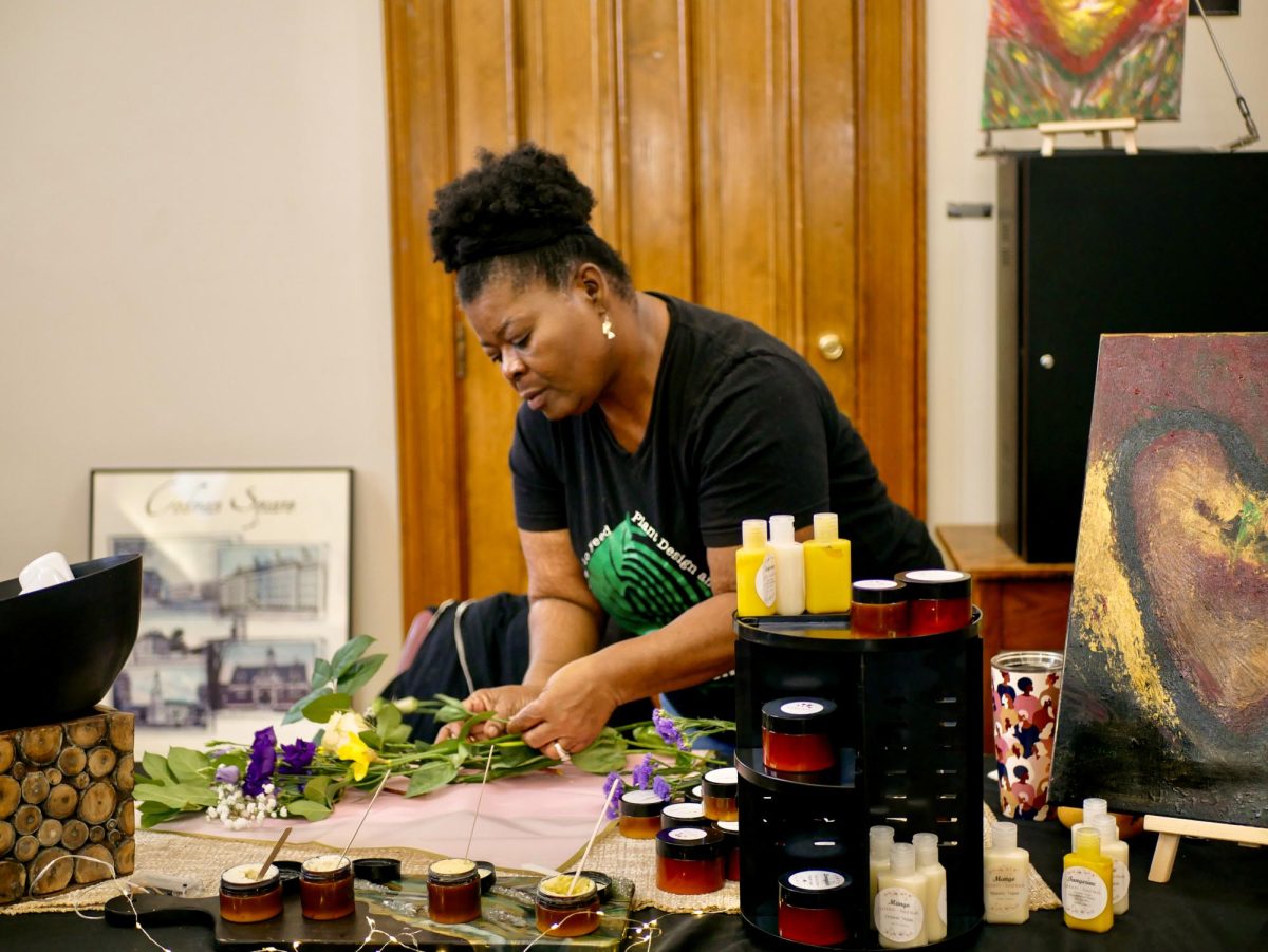 Carter arranges a variety of flowers to wrap a bouquet. Many businesses emphasized the organic ingredients and healing properties of their products. 