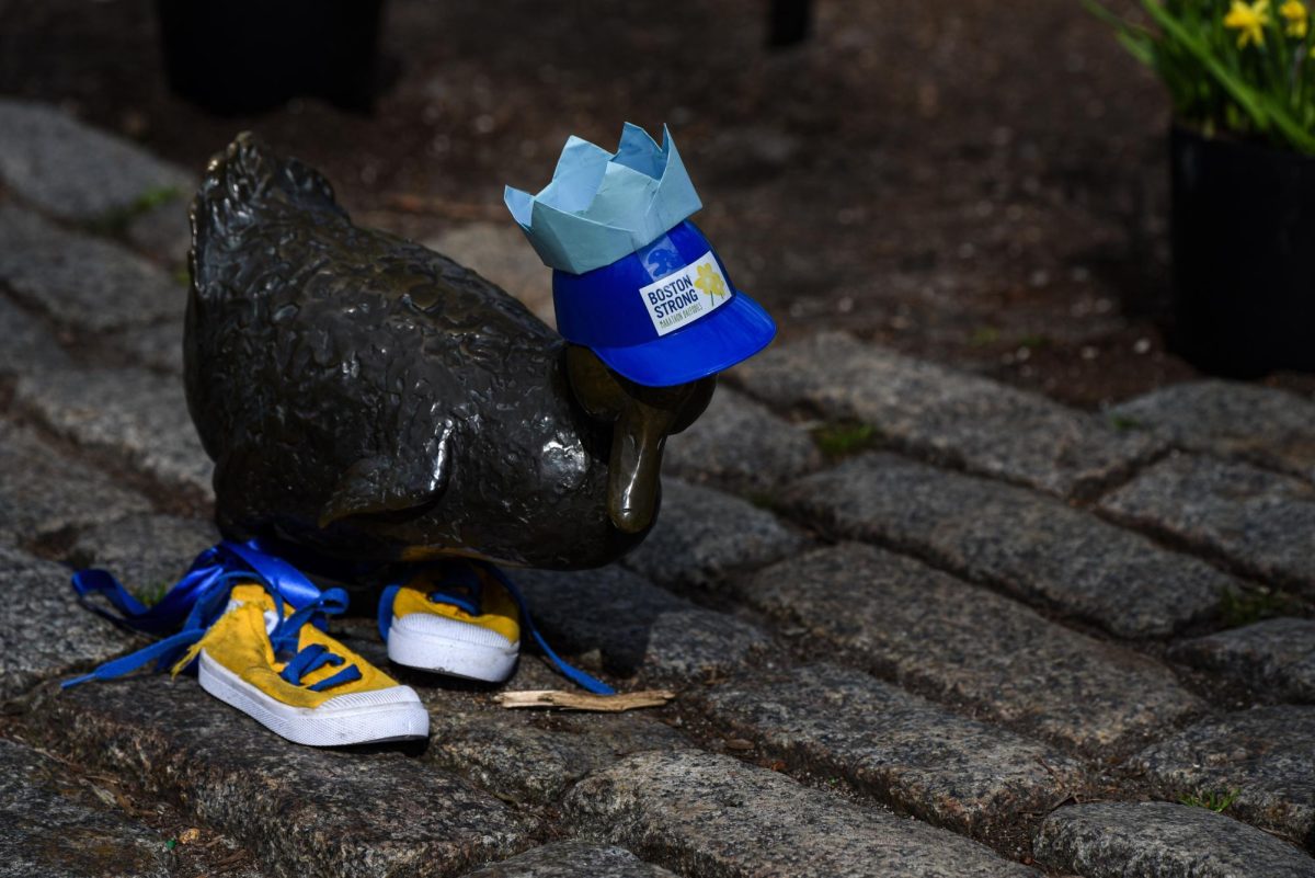 A duckling from the “Make Way for Ducklings” statues in the Boston Public Garden is dressed up for the Boston Marathon. Blue caps, yellow sneakers and ribbons adorned each duck statue.