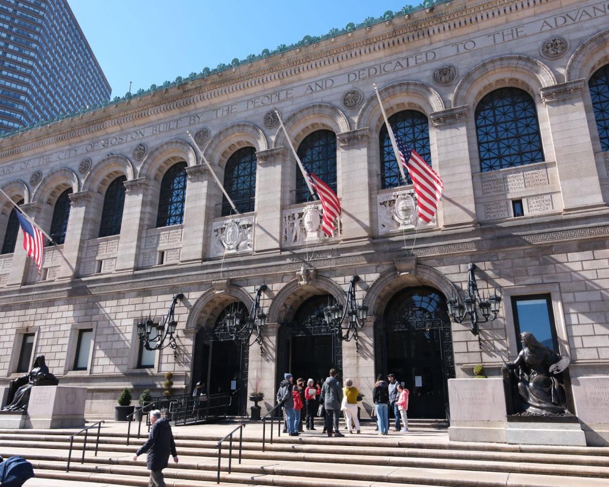 A tour group stands on the front steps of the BPL in Copley Square. During one of the library’s scheduled tours, participants viewed the building’s art and architecture.
