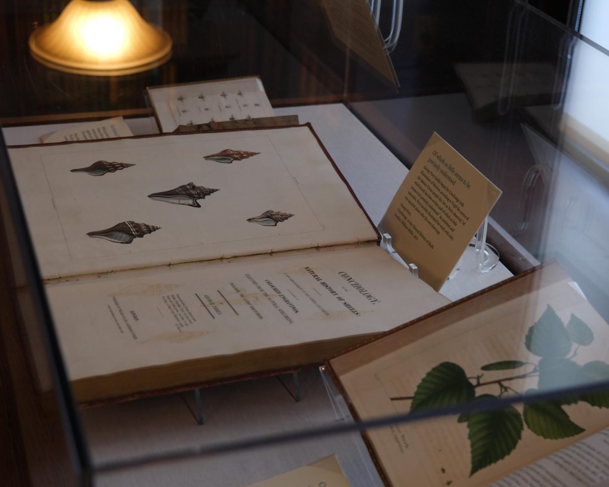 A book on conchology sits open on display in the Dowse Library. Various historical texts, like John Adams’ private diary entries, could be viewed at the MHS.