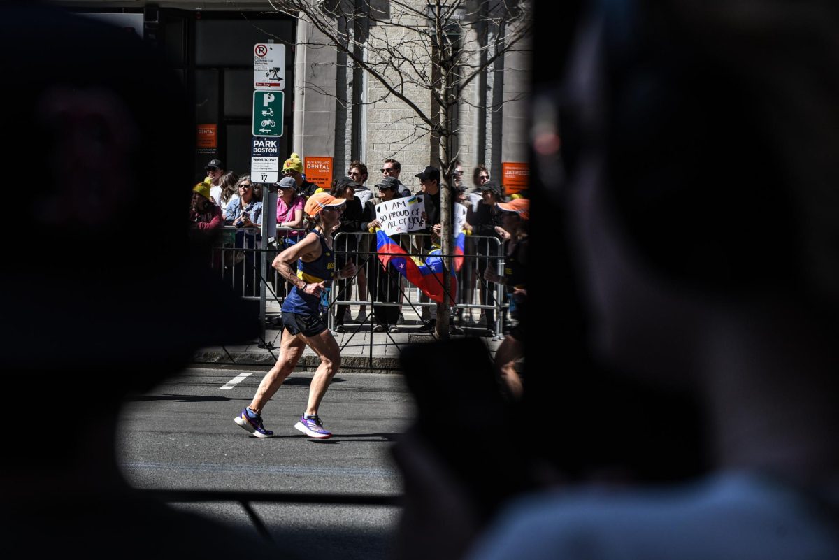 A runner reaches the last 100 feet before the finish line on Bolyston Street.