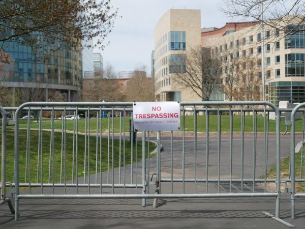 A no trespassing sign hangs from a barricade around Centennial Common. The area remained blocked off after the encampment was cleared April 27.