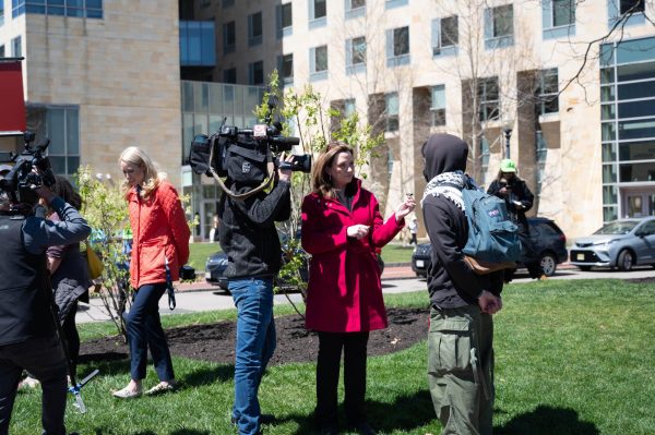 A WCVB reporter interviews a protester. The Centennial Common encampment attracted national press attention.